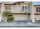 Charming two-story townhome featuring a spacious garage and well-maintained landscaping at 4998 Schumann Dr, Las Vegas, NV 89146