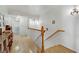 Upstairs hallway with hardwood floors and white banister at 4998 Schumann Dr, Las Vegas, NV 89146