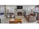 Bright living room with a stone fireplace, large windows, and stylish decor at 4998 Schumann Dr, Las Vegas, NV 89146