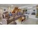 Spacious living room with comfortable seating, open staircase and lots of natural light at 4998 Schumann Dr, Las Vegas, NV 89146