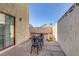 Private patio area perfect for outdoor dining and relaxation with table and chairs at 4998 Schumann Dr, Las Vegas, NV 89146