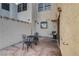 Relaxing patio area with outdoor seating, surrounded by stucco walls for privacy at 4998 Schumann Dr, Las Vegas, NV 89146