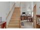 Bright and airy staircase leading to the upper level, complemented by an open living space at 4998 Schumann Dr, Las Vegas, NV 89146