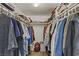 Spacious walk-in closet with organized hanging racks for easy storage and access at 4998 Schumann Dr, Las Vegas, NV 89146