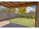 View of backyard showing new turf and concrete block fence for outdoor enjoyment at 5001 Volcanic Rock Ln, Las Vegas, NV 89122