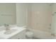 Bright bathroom with a shower-tub combo and a sink at 5001 Volcanic Rock Ln, Las Vegas, NV 89122