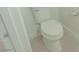 Bathroom featuring a white toilet and coordinating accessories at 5001 Volcanic Rock Ln, Las Vegas, NV 89122