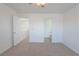 Bedroom featuring neutral carpet and access to other rooms at 5001 Volcanic Rock Ln, Las Vegas, NV 89122