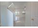 Inviting foyer with tiled flooring, leading to the living area and staircase to the upper level at 5001 Volcanic Rock Ln, Las Vegas, NV 89122