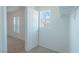 Bright walk-in closet features a window and access to another carpeted bedroom at 5001 Volcanic Rock Ln, Las Vegas, NV 89122