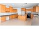 Well-lit kitchen with ample countertop space and an island with a breakfast bar at 5396 Valley Wells Way, Las Vegas, NV 89113