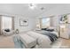 Serene bedroom with neutral tones, plush bedding, and ample natural light at 5396 Valley Wells Way, Las Vegas, NV 89113