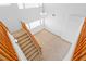 Staircase with a wooden railing and carpeted steps leading to the upper level of the house at 5396 Valley Wells Way, Las Vegas, NV 89113