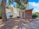 The backyard features a brick patio, a white privacy fence, and a lush, mature shade tree at 540 Tam O Shanter, Las Vegas, NV 89109