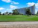Green lawn stretches out to meet a large, multistory building at 540 Tam O Shanter, Las Vegas, NV 89109