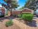 Brick exterior with a well-manicured lawn and mature, lush landscaping at 540 Tam O Shanter, Las Vegas, NV 89109