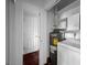 Laundry room featuring a modern washing machine and a water heater at 540 Tam O Shanter, Las Vegas, NV 89109