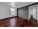 Large living room featuring hardwood floors, natural light, and contemporary wall texture at 540 Tam O Shanter, Las Vegas, NV 89109