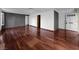 Spacious living room with wood floors and access to other rooms in the home at 540 Tam O Shanter, Las Vegas, NV 89109