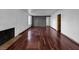 Cozy living room featuring rich wood floors, a fireplace, and neutral paint at 540 Tam O Shanter, Las Vegas, NV 89109