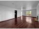Open concept living room featuring gorgeous wood floors and access to other rooms at 540 Tam O Shanter, Las Vegas, NV 89109