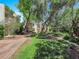 Manicured lawn and trees around a two-story condo building; mature landscaping on display at 540 Tam O Shanter, Las Vegas, NV 89109