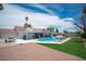 Beautiful backyard featuring a pool, patio, and green lawn at 5515 Coley Ave, Las Vegas, NV 89146