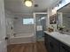 Beautiful bathroom with a combined shower and tub, and sleek vanity with modern fixtures at 5515 Coley Ave, Las Vegas, NV 89146