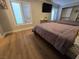 Cozy bedroom with hardwood floors, with closet and two windows providing natural light at 5515 Coley Ave, Las Vegas, NV 89146