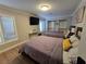 Cozy bedroom with two beds, ample natural light, and closet space, offering a comfortable retreat at 5515 Coley Ave, Las Vegas, NV 89146
