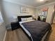 Bedroom features modern decor, hardwood floors, a large window and large mirrored closet at 5515 Coley Ave, Las Vegas, NV 89146
