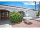 Charming home featuring a well-maintained front yard with mature landscaping, a fountain, and a brick facade at 5515 Coley Ave, Las Vegas, NV 89146