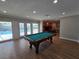 Game room featuring a pool table, hardwood floors, and access to the pool at 5515 Coley Ave, Las Vegas, NV 89146