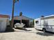 Wide view of a large garage with a boat and recreational vehicle in front on a concrete pad at 5515 Coley Ave, Las Vegas, NV 89146