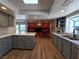 Modern kitchen with sleek countertops, stainless steel sink, gray cabinets, and a cozy breakfast nook at 5515 Coley Ave, Las Vegas, NV 89146