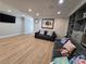 Spacious living room with hardwood floors, recessed lighting, and built-in shelving, ideal for entertaining at 5515 Coley Ave, Las Vegas, NV 89146