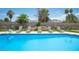 Inviting pool area with ample seating and lush landscaping at 5515 Coley Ave, Las Vegas, NV 89146