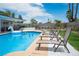 Sparkling pool surrounded by lounge chairs and well maintained landscaping at 5515 Coley Ave, Las Vegas, NV 89146