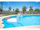 Backyard pool with tropical landscaping and an inflatable unicorn at 5515 Coley Ave, Las Vegas, NV 89146