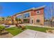 Backyard featuring a well-maintained lawn, lounge chairs, and artistic murals on the walls at 5626 Deer Creek Falls Ct, Las Vegas, NV 89118