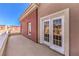 Balcony with white railing offering a view, and access to room through glass paneled doors at 5626 Deer Creek Falls Ct, Las Vegas, NV 89118