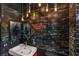 Chic bathroom showcasing graffiti art, black tile, a modern sink, and custom mirrors for an unique aesthetic at 5626 Deer Creek Falls Ct, Las Vegas, NV 89118