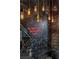 Edgy bathroom features dark tile, unique lighting, and graffiti-style art for a bold statement at 5626 Deer Creek Falls Ct, Las Vegas, NV 89118
