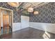 Bright bedroom with hardwood floors, damask wallpaper, and closet at 5626 Deer Creek Falls Ct, Las Vegas, NV 89118