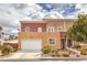 Inviting two-story home featuring a garage, well-kept lawn, and elegant front entrance at 5626 Deer Creek Falls Ct, Las Vegas, NV 89118