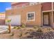 Charming two-story home exterior with a well-maintained yard, attached garage, and inviting entrance at 5626 Deer Creek Falls Ct, Las Vegas, NV 89118