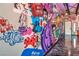 Hallway with custom graffiti art and epoxy flooring at 5626 Deer Creek Falls Ct, Las Vegas, NV 89118