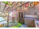 Kitchen features colorful epoxy floors, graffiti art, and island seating at 5626 Deer Creek Falls Ct, Las Vegas, NV 89118