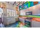 Kitchen featuring graffiti, stainless steel appliances, and unique countertops at 5626 Deer Creek Falls Ct, Las Vegas, NV 89118