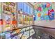 Room with graffiti art, large windows and light-filled spaces at 5626 Deer Creek Falls Ct, Las Vegas, NV 89118